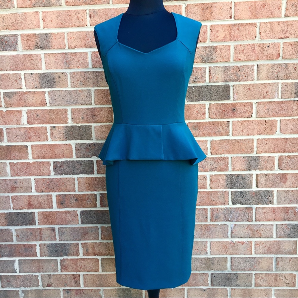 Body perfecting peplum sheath dress